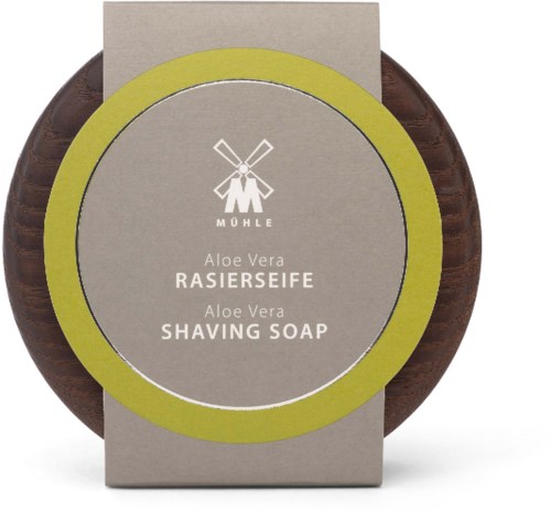 Round brown shaving soap with a gray label and green border, displaying the MÖHLE logo and product details for Aloe Vera.