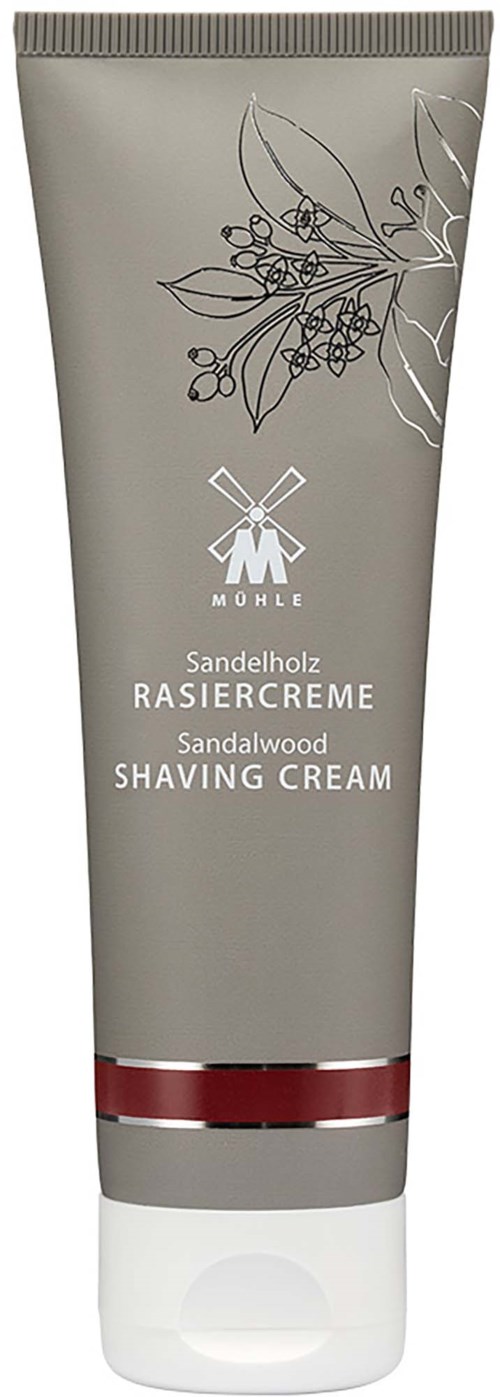Grå tub med sandalmint rakhyvels cream med en röd band nära botten och en svartvit lövillustration.