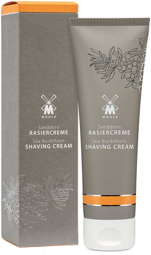 Shaving cream tube og eske med havtornillustrasjon og sølv- og oransje detaljer.