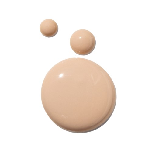 Tre beige, runda föremål i olika storlekar placerade vertikalt mot en vit bakgrund.