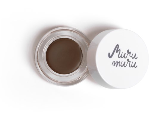 Ein kleiner Behälter mit dunkler Creme oder Gel, und ein weißer Deckel mit handgeschriebenem Text "Muru muru."