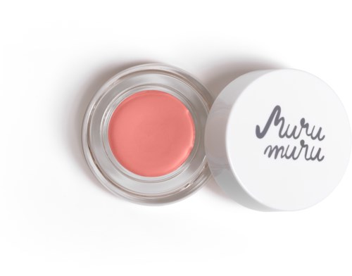 A small jar with pink cream or wax, next to a white lid with black writing.