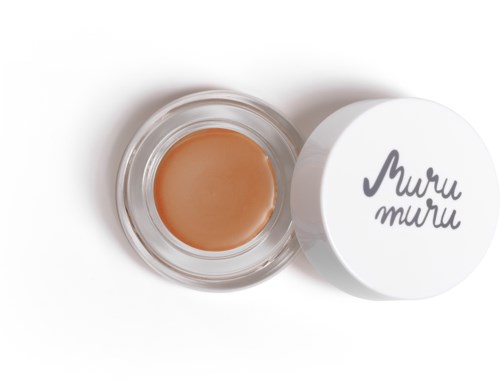 En liten burk med beige färgad kräm eller salva, med lock som säger "Muru Muru".