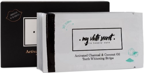En låda med tandskyddsremsor märkt 'my little secret' med aktivt kol och kokosolja, 30 remsor ingår.