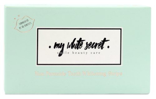 En mintgrön box märkt 'My White Secret' för tandblekning, med extra text om icke-peroxidstrips.
