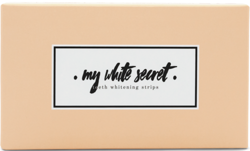 En ljusbeige låda med en etikett som säger "my white secret" och "tandblekningsremsor."