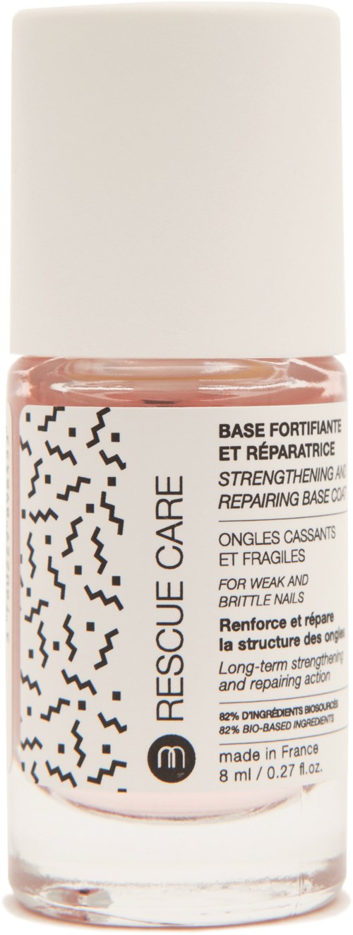 En flaska nagelstärkande och reparerande baslack med svartvit design och text på etiketten.