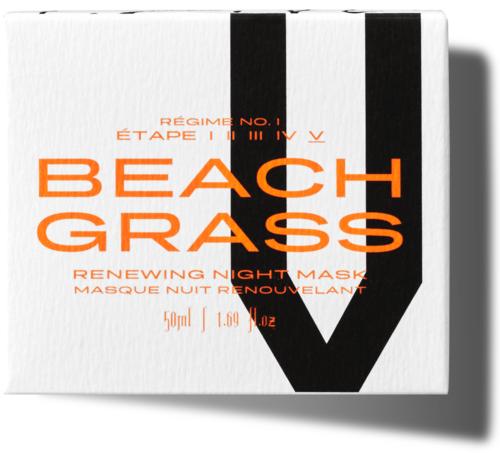 En boxetikett med orange och svart text, nämner Beach Grass och förnyande nattmask. Den har en stor svart V-form.