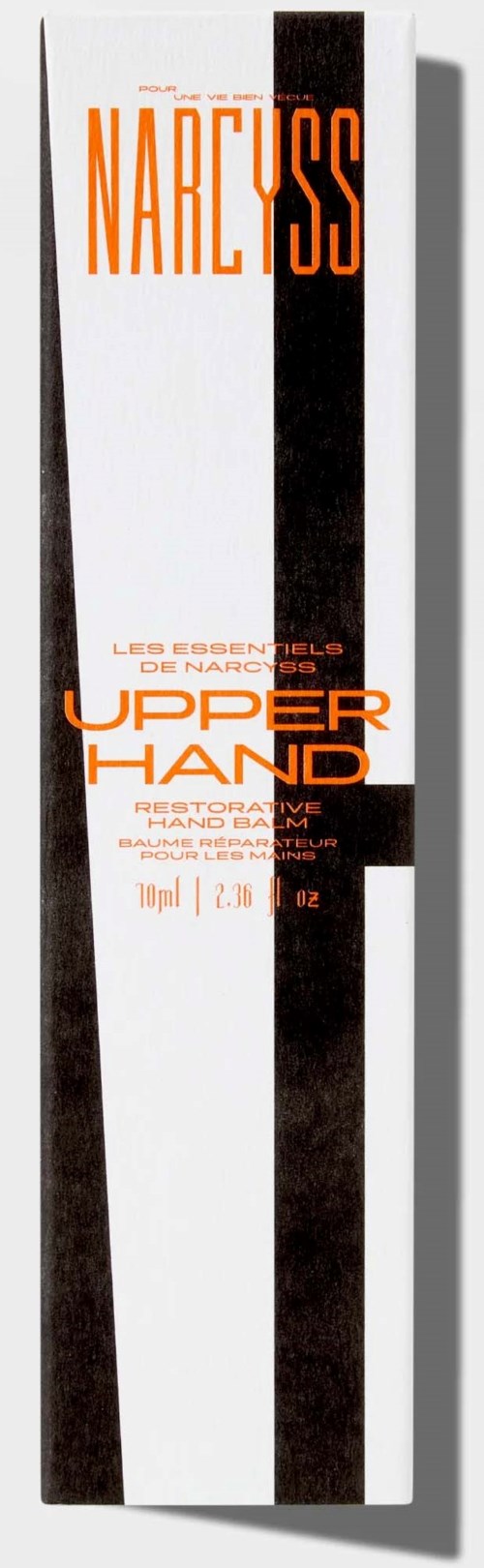 En lang eske med oransje og svart tekst, med en svart stripe ned midten, som annonserer hudpleieprodukter.