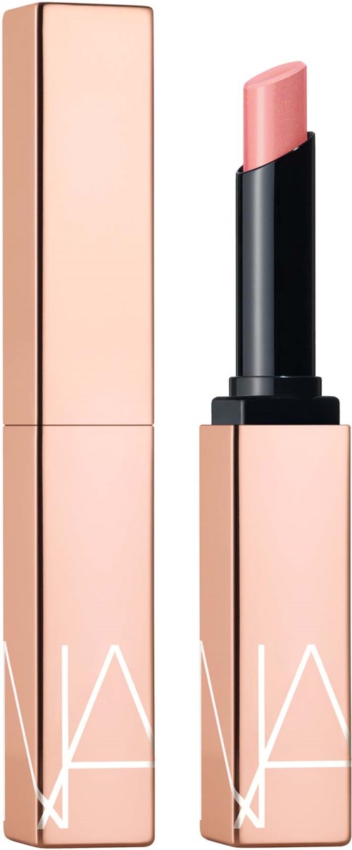 A pink lipstick in a black tube with a pink cap, standing upright next to its tall pink packaging.