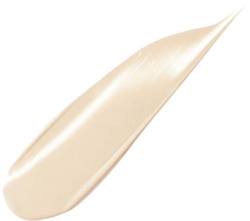 En liten mengde med kremaktig hvit lotion eller krem med glatt overflate og spiss form.
