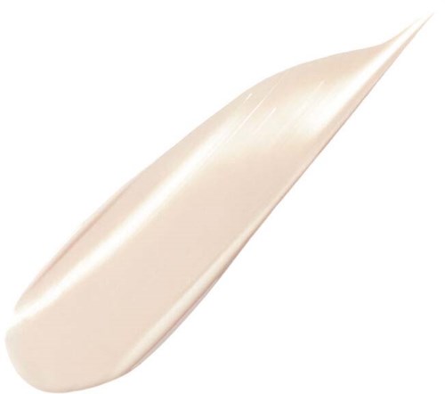 En beige eller kremfarget krem eller lotion på en spatula. Objektet brukes til hud- eller kosmetiske formål.