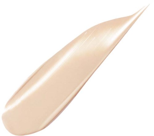 En beige eller lysfarget krem eller lotion på en spatula eller påføring.
