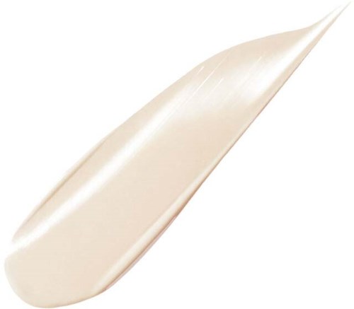 En hvit eller lys beige kremet substans på en glatt overflate, muligens en lotion eller krem, med et svakt glans.