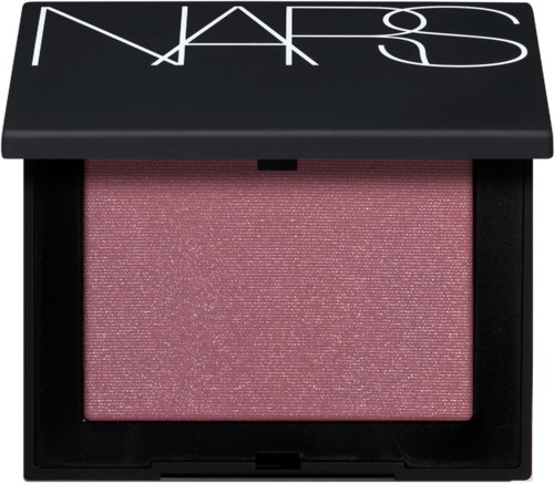 Pink shimmery blush inside a black compact with a lid showing NARS logo.