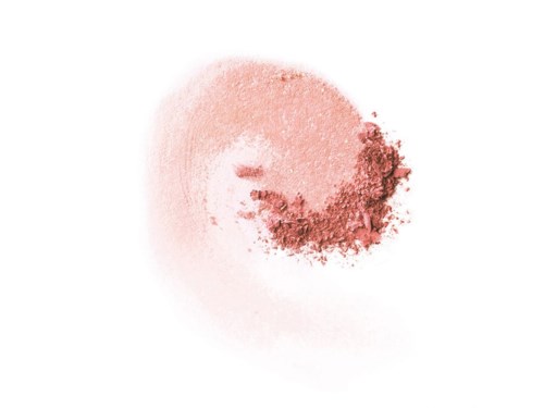 En mjuk rosa makeup-rouge med lite mörkare puder utspritt ovanpå. Inga andra föremål eller detaljer syns.