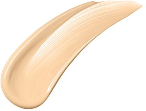 Een beige gekleurde crème of foundation met gladde, dikke textuur op een witte achtergrond.