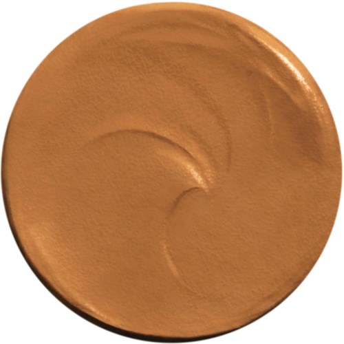 Eine runde, orangebraune Make-up-Box mit glatter, leicht glänzender Oberfläche.