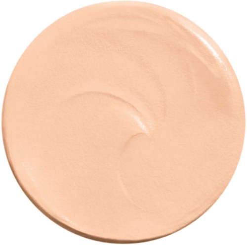 Ein großer, runder, beiger Make-up-Produkte mit glatter Textur und leichtem Glanz.