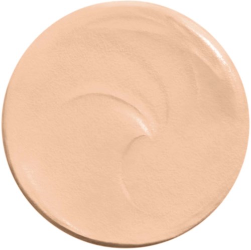 Ein beiger Make-up-Foundation oder Creme in einem runden Behälter. Es hat eine glatte, leicht glänzende Oberfläche.