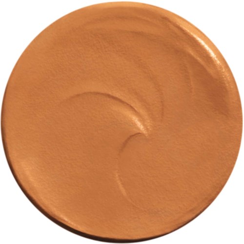Ein runder, beiger Make-up-Produkt mit glatter Oberfläche und geschwungenen Linien im Inneren.