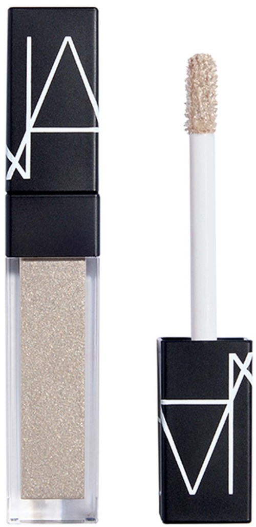 NARS flytande highlighter i en genomskinlig flaska med svart lock och vit logga, och en applikator med svampstift.