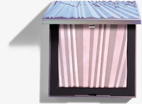 A compact makeup product with a pink and white striped pattern inside, with a metallic, textured lid.