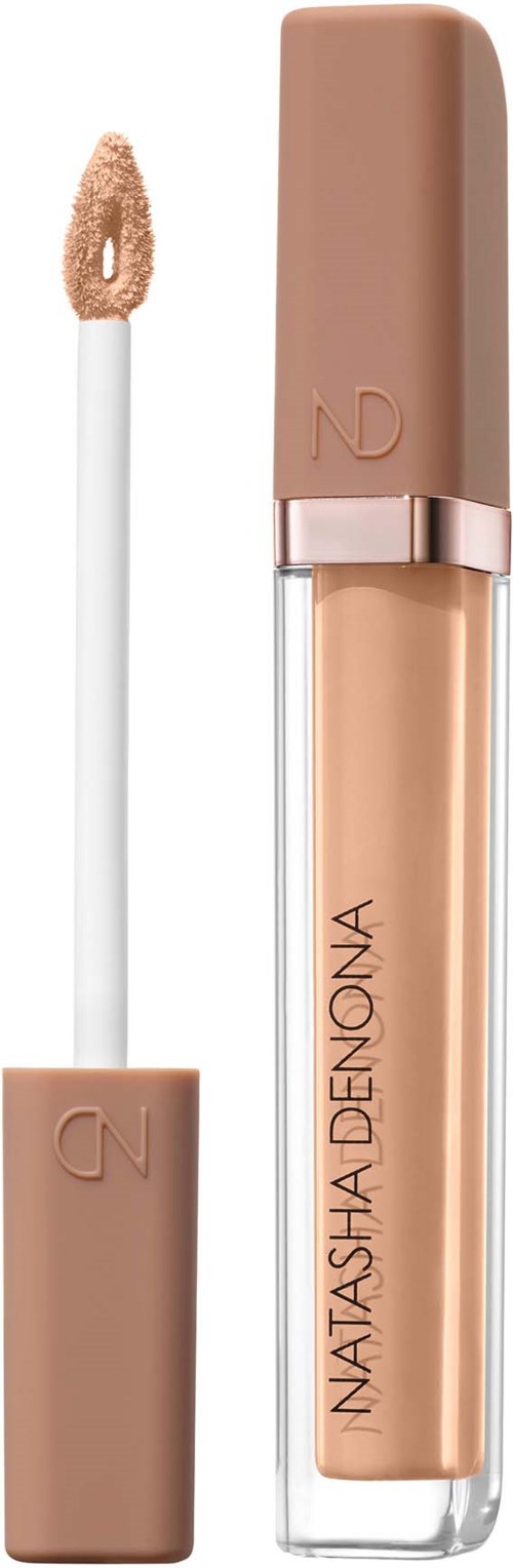 En flytande concealer i ett beige rör med ett mjukt appliceringsborste för makeup.
