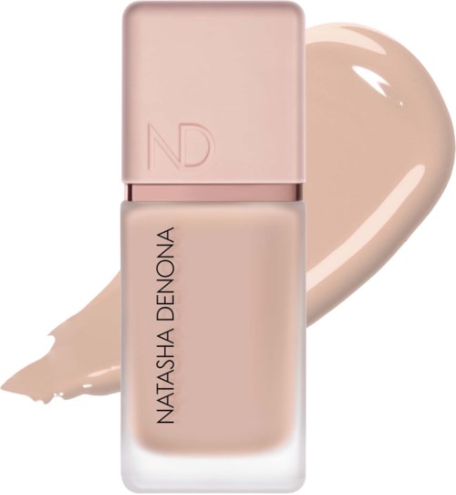 En beige vätskefoundation med en ljusrosa kork och märket Natasha Denona på flaskan.