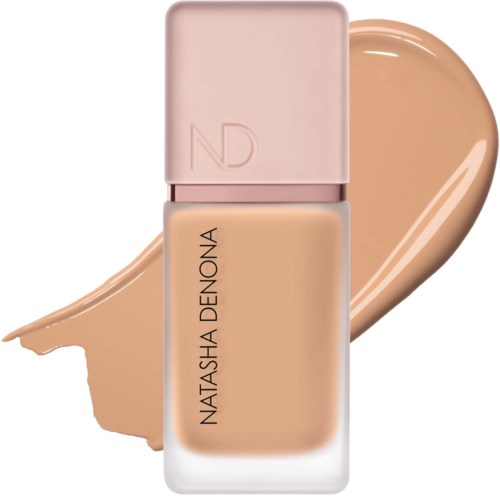 En foundationflaska med rosa lock och en klick beige vätska bakom.
