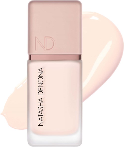 En nagellackflaska i mjuk rosa färg med varumärket Natasha Denona.
