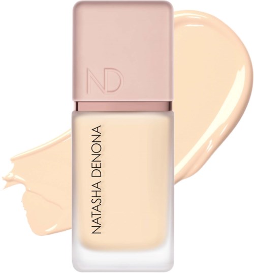 En flaska med Natascha Denona foundation med en beige kräm bakom.