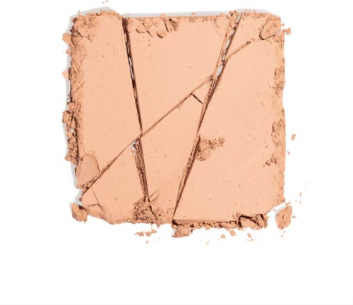 Krossad beige puder med linjer och sprickor. Ser ut som makeup- eller ansiktspuder. Vissa delar är trasiga.