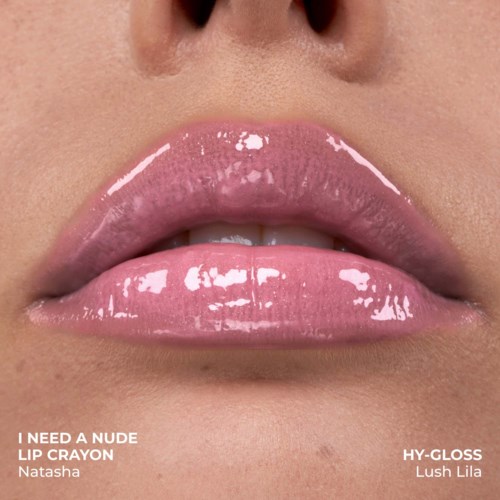 Close-up of glossy pink lips with a slight part. Text overlay mentions a nude lip crayon and gloss.