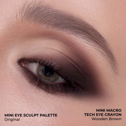 Close-up of a person's eye with smoky eye makeup in shades of brown and beige.