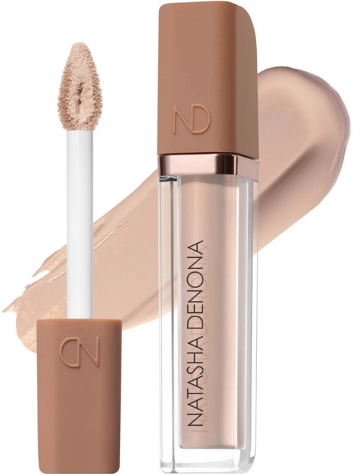 Lip gloss with beige packaging and applicator, swiped across a beige background. Clear tube with brand name Natasha Denona.