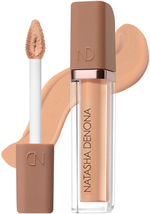 Liquid concealer in a clear tube with N and D logo on the cap and a beige swatch in the background.