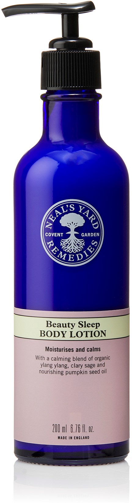 Blå flaska märkt 'Beauty Sleep Body Lotion' med pump, innehåller lugnande lotion för huden.