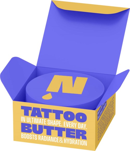 A yellow and purple box of tattoo butter with bold text on the packaging and an open lid.