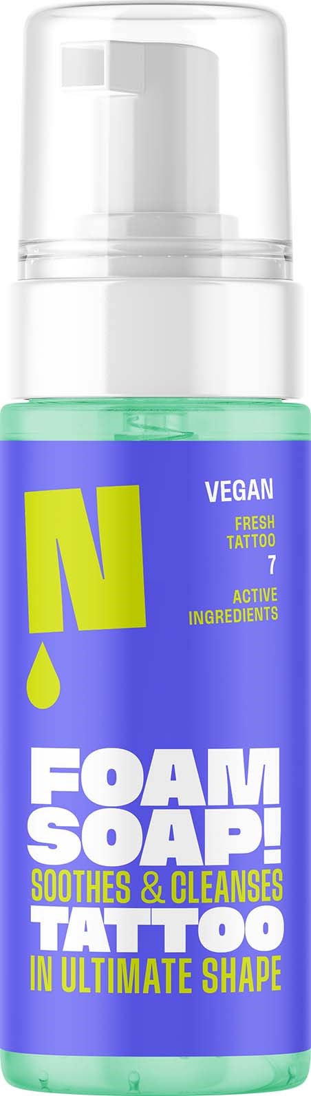 Vegan foam soap in a blue bottle with yellow and white text, promoting tattoo care and skin soothing.