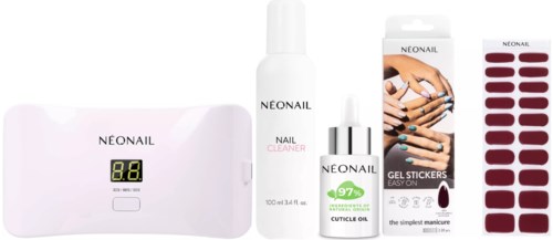 Ein Nagelpflege-Set mit Gerät, Reiniger, Gelaufkleber und Nagellack für einfache Nagelverschönerung.
