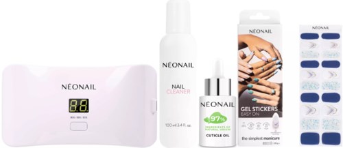 Set of nail care products including a UV lamp, nail cleaner, cuticle oil, gel stickers, and a phone display.