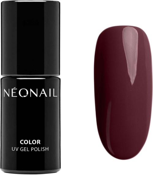 A black nail polish bottle labeled 'NEONAIL' next to a polished burgundy nail.