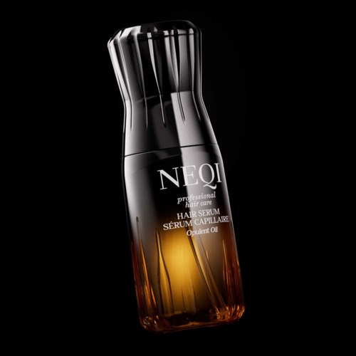 Elegancka czarna i bursztynowa butelka serum do włosów z nowoczesnym designem i srebrną nakrętką.