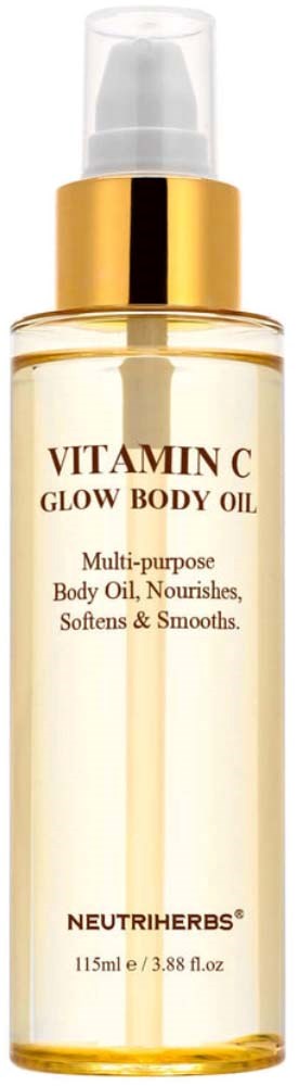 A tall, clear bottle with a gold cap, labeled Vitamin C Glow Body Oil, contains golden liquid.