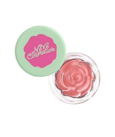 En grøn beholder med pink tekst og en vridende lyserød creme indeni.