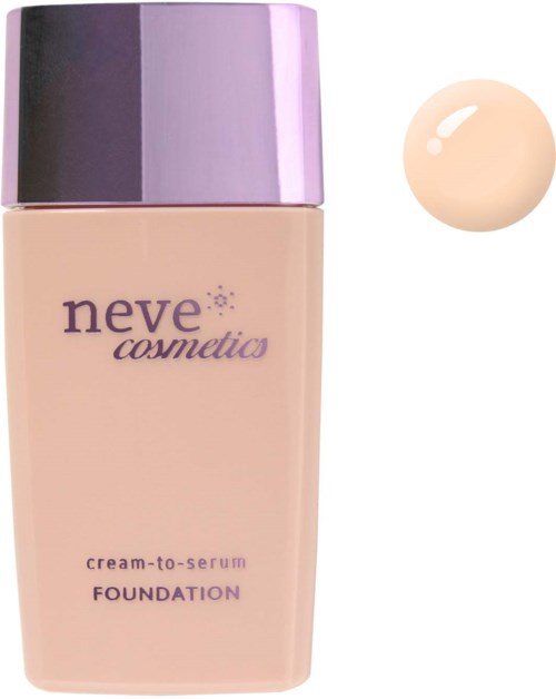 A beige bottle of Neve Cosmética foundation with a purple cap. Swatch of the foundation color beside it.