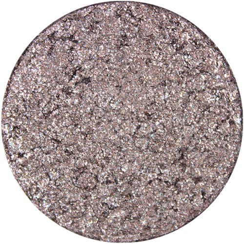 En rund, glitterig, silver- och brunglittrig ögonskugga med en grov, texturerad yta.