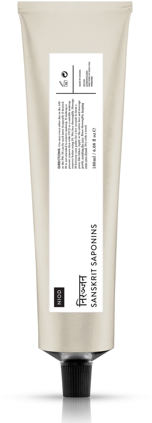 Eine Tube mit weißer Verpackung und schwarzem Deckel, beschriftet mit Produktdetails und Text.