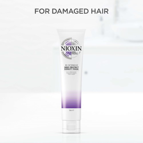 En hårinpackning för skadat hår i en vit tub med lila detaljer och "NIOXIN" på.